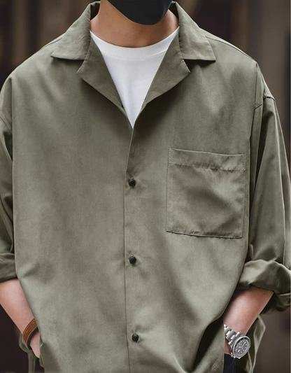 Light green Cuban collar shirt styled casually with white tee.