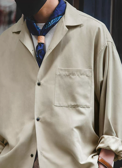Light khaki Cuban collar shirt styled with scarf and white tee.