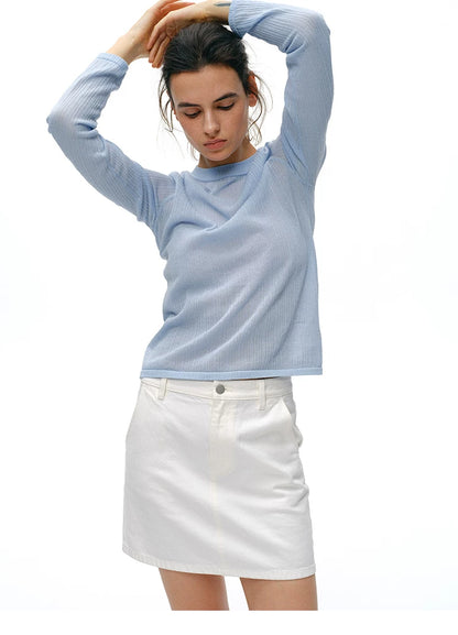 Close-up of powder blue knit top gathered shoulder detail