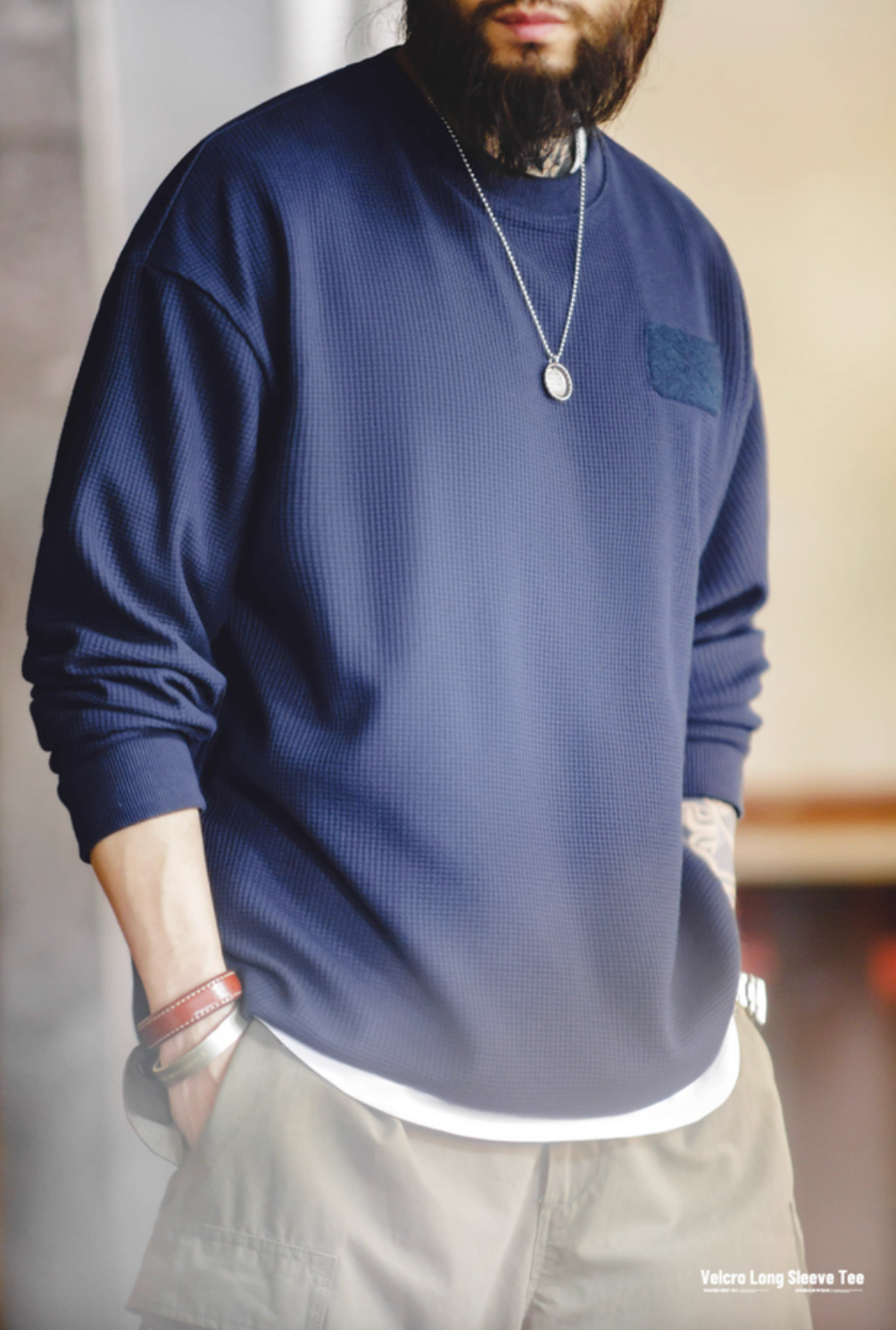 Man wearing navy blue custom Velcro long sleeve waffle tee highlighting waffle texture and relaxed everyday style