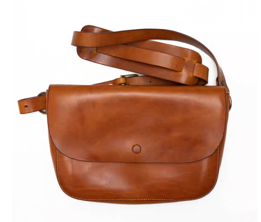 Light brown full-grain Italian leather crossbody bag on white background with adjustable strap