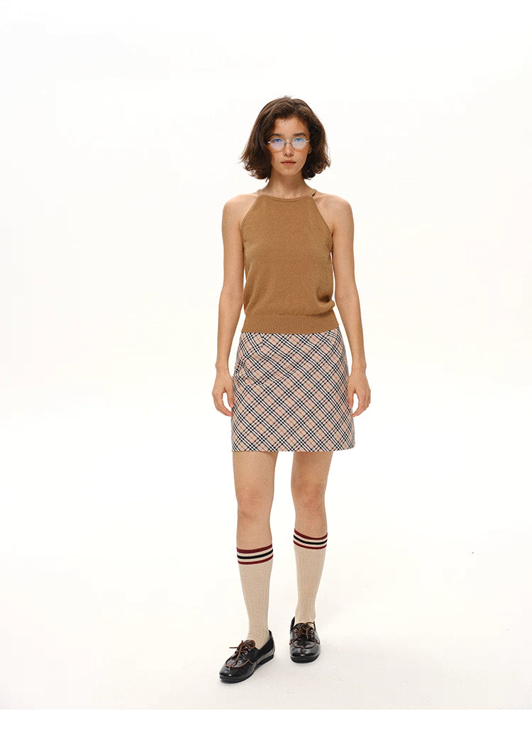 Camel Brown merino wool tank top styled with plaid skirt, full-body front view