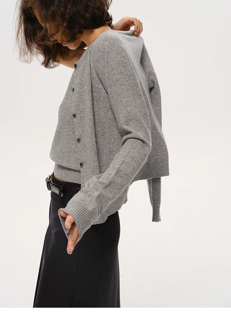 Heather Gray merino wool cardigan in motion, showing sleeve texture and drape