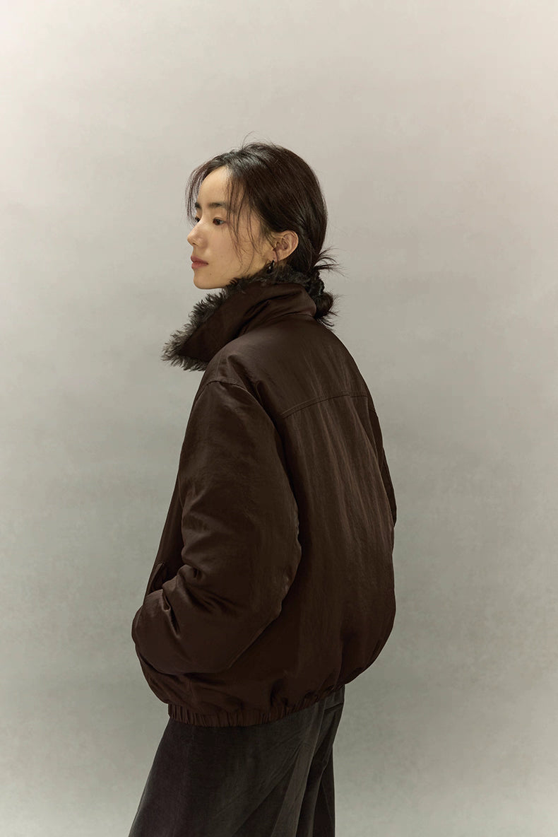 Side-back profile of dark coffee brown sherpa-collar down jacket showing relaxed fit