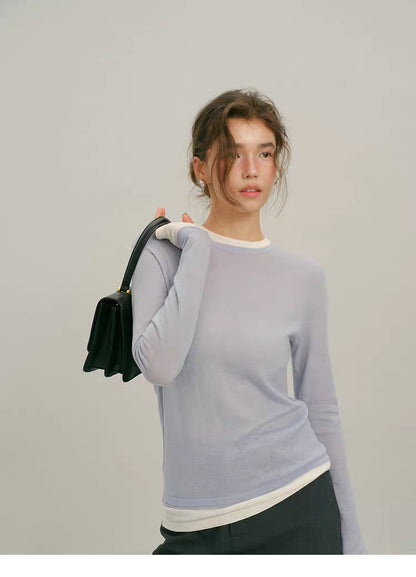 Dusty Blue fine wool layered long-sleeve top, front pose with black handbag