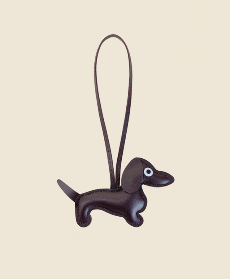 Coffee brown dachshund leather keychain charm side view showing body shape and strap