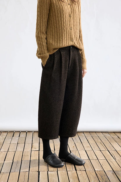 Side view of Dark Brown high-rise cropped bouclé trousers with front pleats