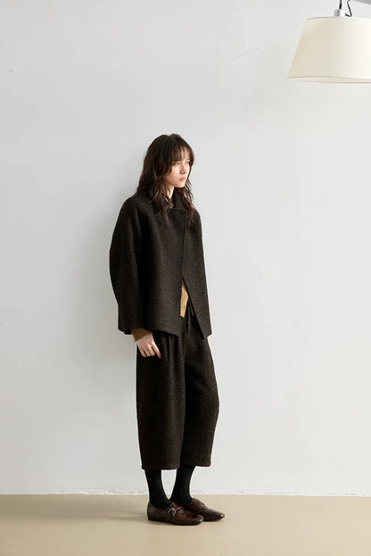 Full-length side view of a Dark Brown bouclé jacket and mid-calf cropped trousers
