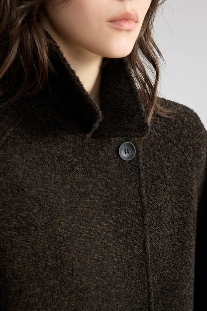 Close-up of a Dark Brown bouclé jacket&