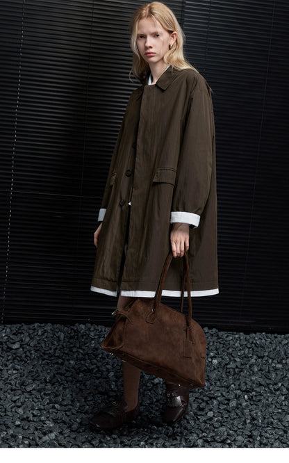 Full-length front view of a Dark Brown faux-layered mac coat with flap pockets and white cuff trim
