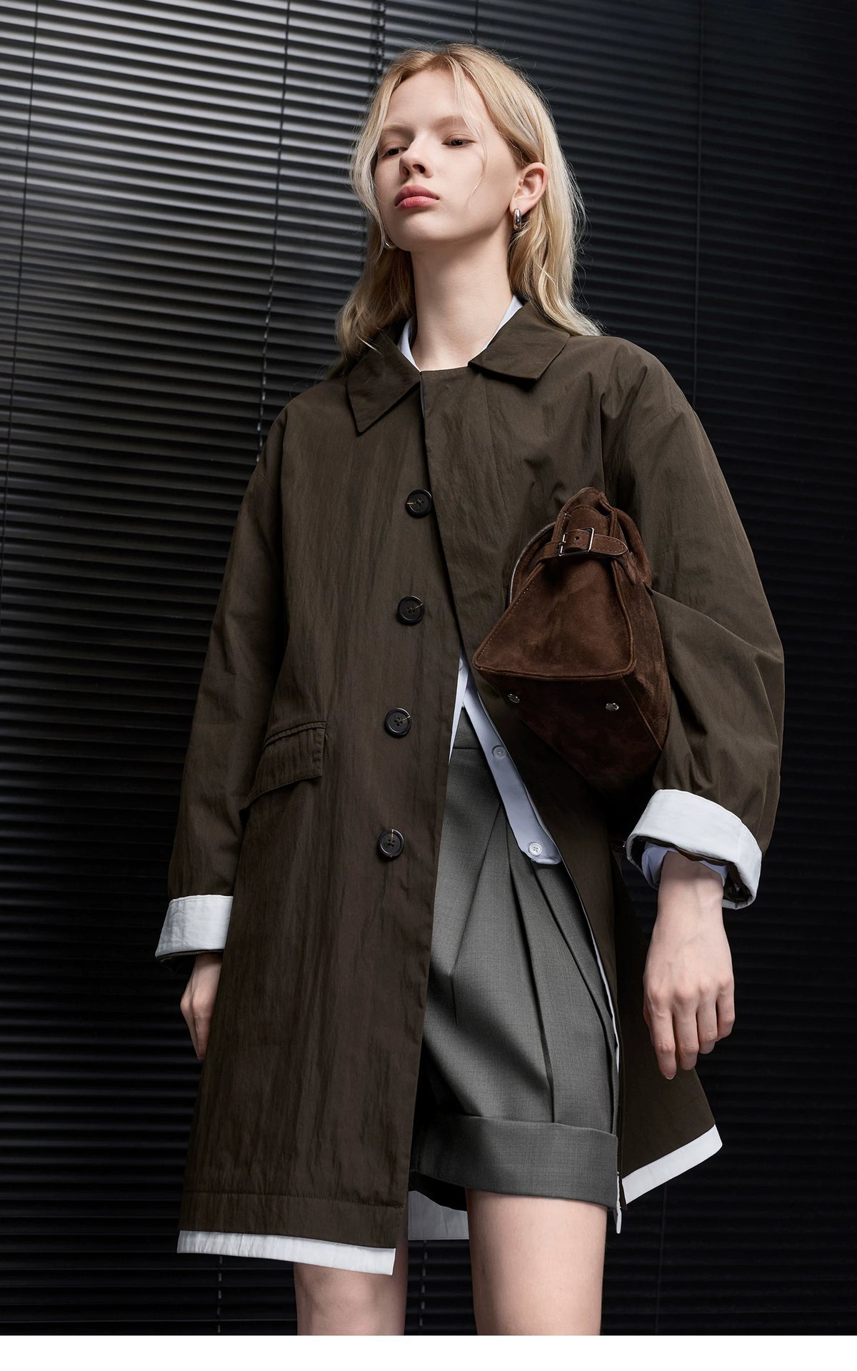 Dark Brown oversized mac coat worn open, showing white contrast trim at the rolled cuffs and hem