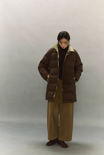 Women’s dark coffee brown down coat worn open to show contrasting khaki lining and relaxed fit