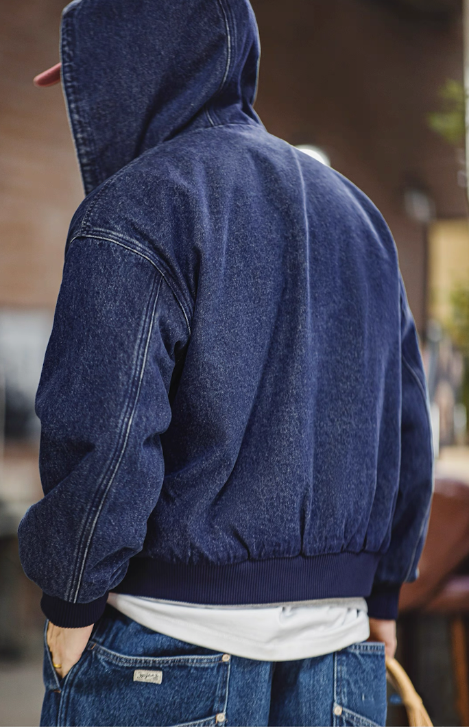 Back view with hood up, showing yoke seam and gathered waistband.