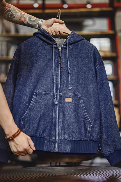 Hanging front view of denim zip hoodie showing drawcord hood and center zipper.