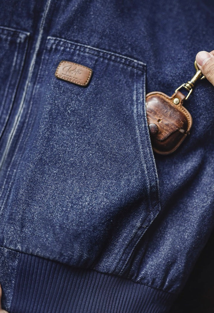 Close-up of front pocket carrying a small case to show pocket depth.