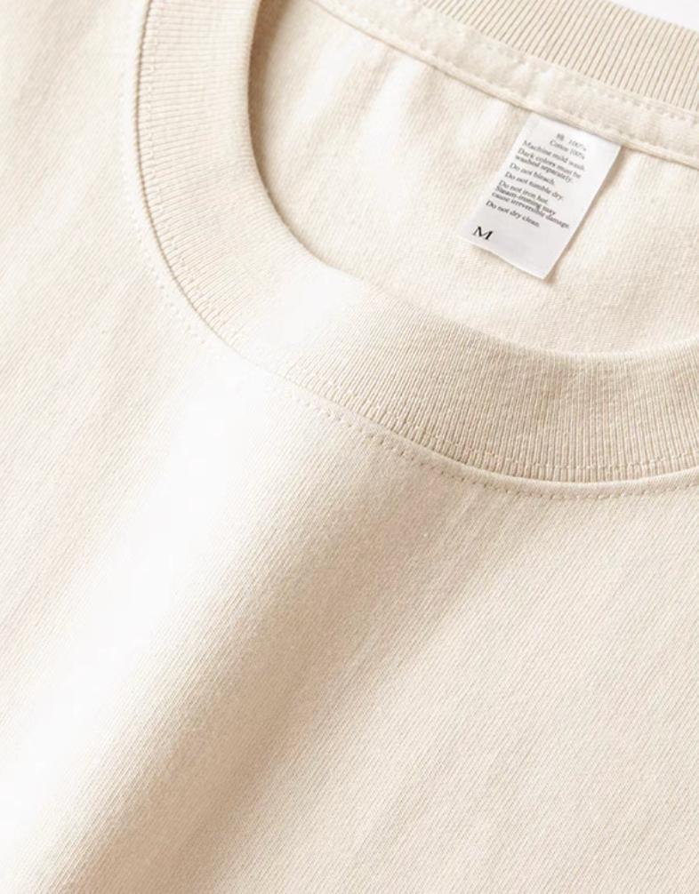 Desert Rider Graphic Cotton Tee Cream White close-up of ribbed crewneck collar and cotton fabric texture