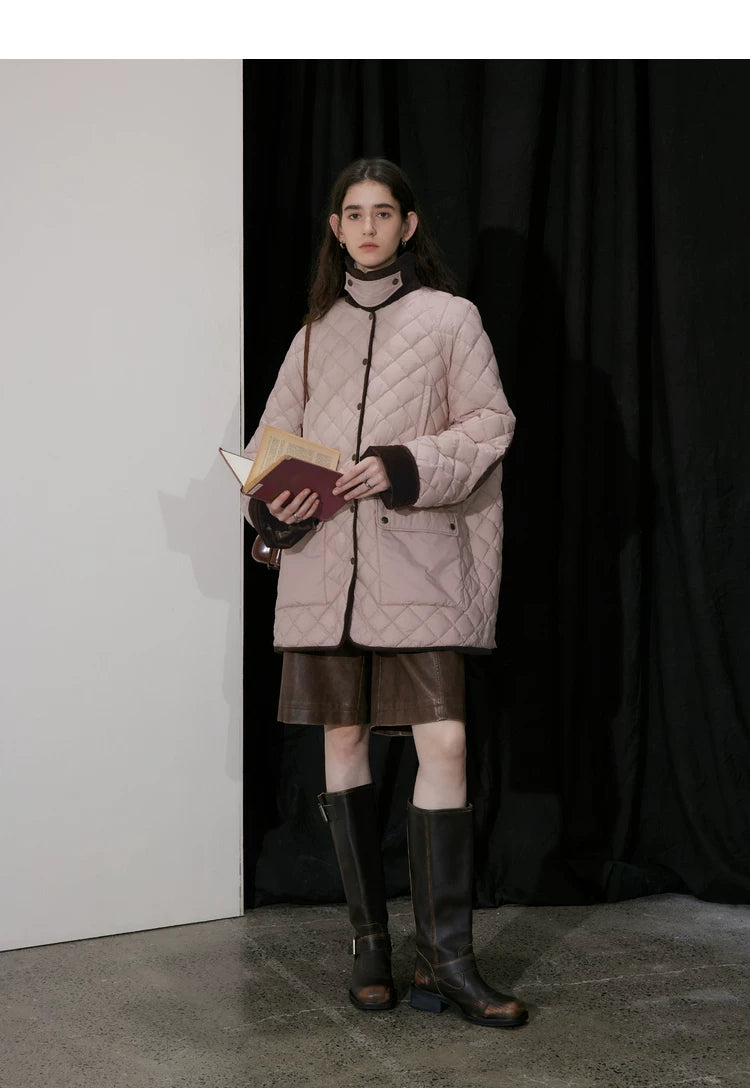Pink diamond-quilted down coat snapped closed with standing collar and flap pockets