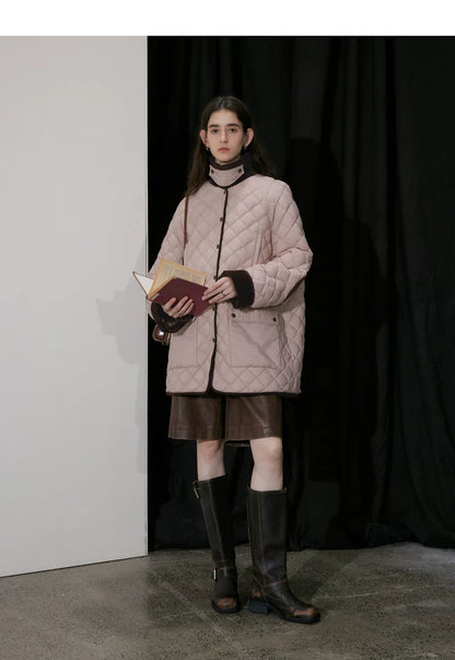 Pink diamond-quilted down coat snapped closed with standing collar and flap pockets