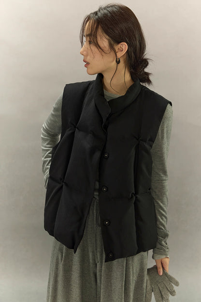 side profile of woman wearing black hollow-fiber down vest