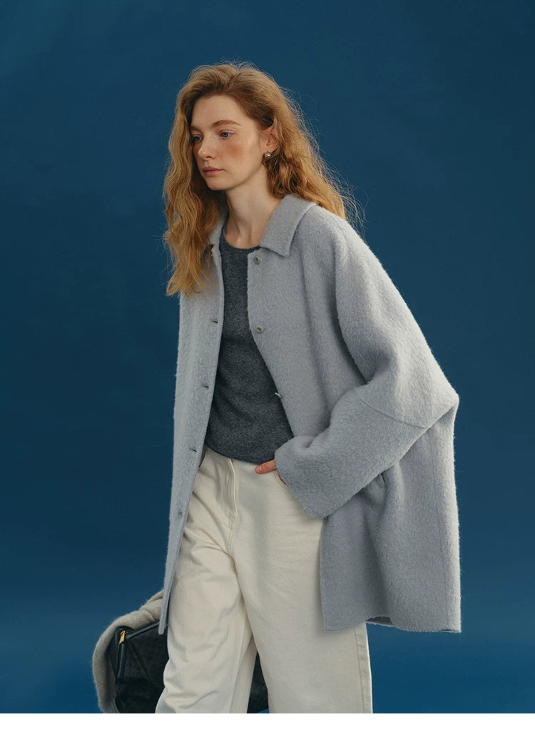 Dusty Blue brushed alpaca-wool coat worn open, showing the point collar and wide dropped sleeves