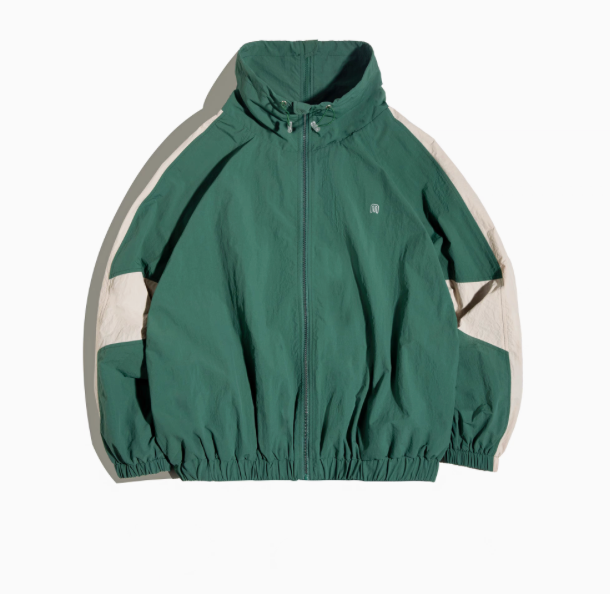 Dynamic Layering Jacket in Arden Green front view showing double zipper closure, high collar with drawstrings and elastic hem