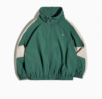 Dynamic Layering Jacket in Arden Green front view showing double zipper closure, high collar with drawstrings and elastic hem