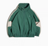 Dynamic Layering Jacket in Arden Green front view showing double zipper closure, high collar with drawstrings and elastic hem