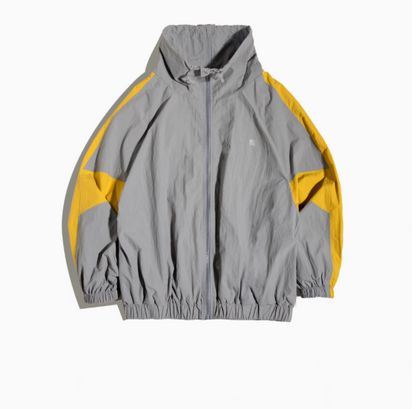 Dynamic Layering Jacket in Scottish Grey front view showing double zipper closure, elastic cuffs and gathered hem