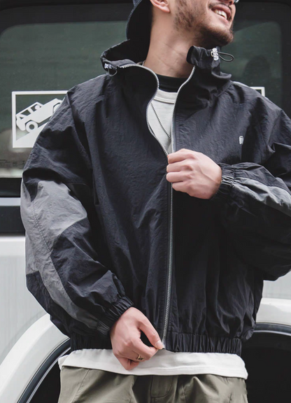Front view of Sumatra Black Dynamic Layering Jacket worn by model showing relaxed fit and modern street style