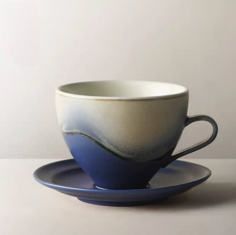Kiln-Change Blue ceramic coffee cup and saucer front view featuring deep blue gradient glaze and minimalist form