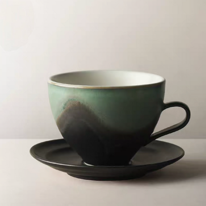 Kiln-Change Dark Green ceramic coffee cup and saucer front view with deep earthy gradient glaze and refined silhouette