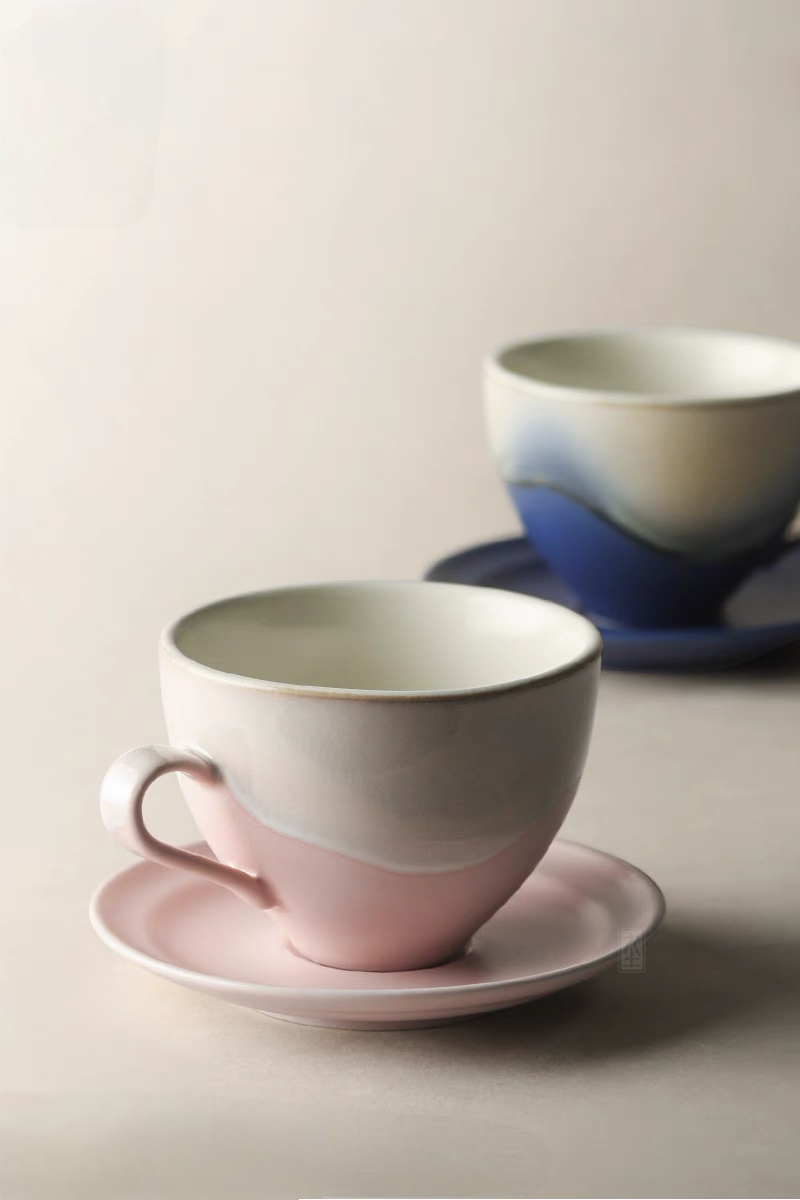 Kiln-Change Pink ceramic coffee cup and saucer set front view with soft gradient glaze and smooth rounded shape