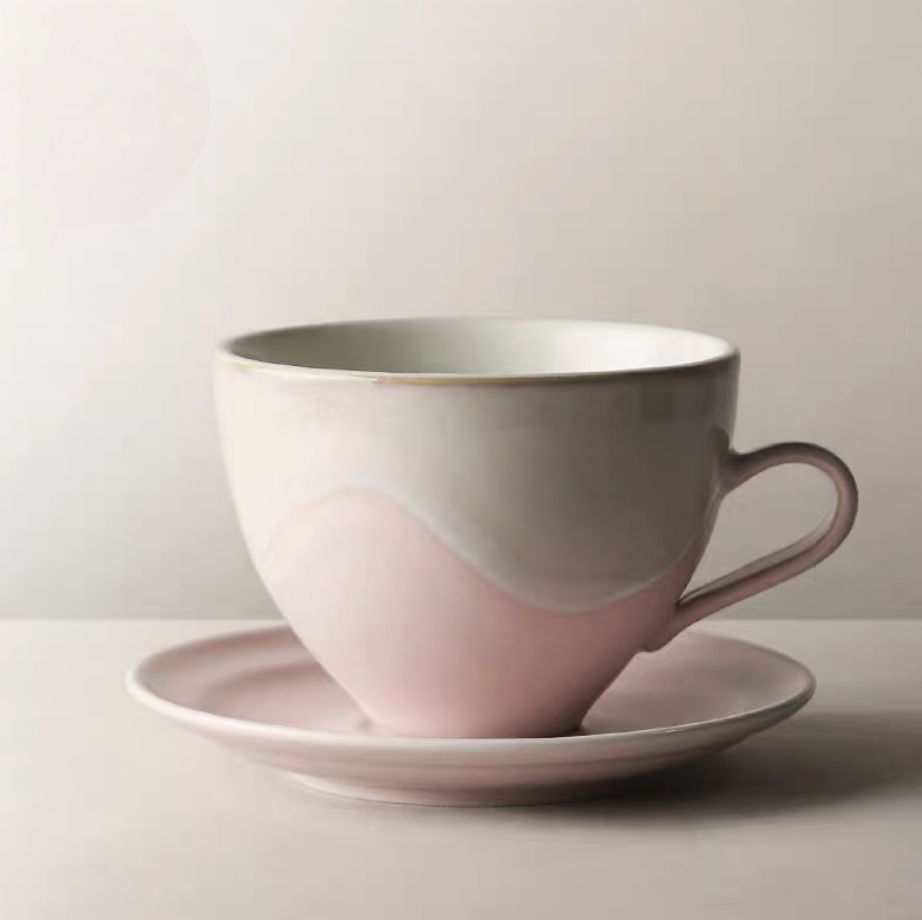 Kiln-Change Pink ceramic coffee cup side view highlighting curved handle and artistic glaze transition