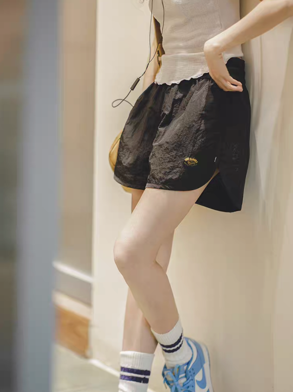 Effortless Sport Shorts black worn with sleeveless top in casual indoor lifestyle setting