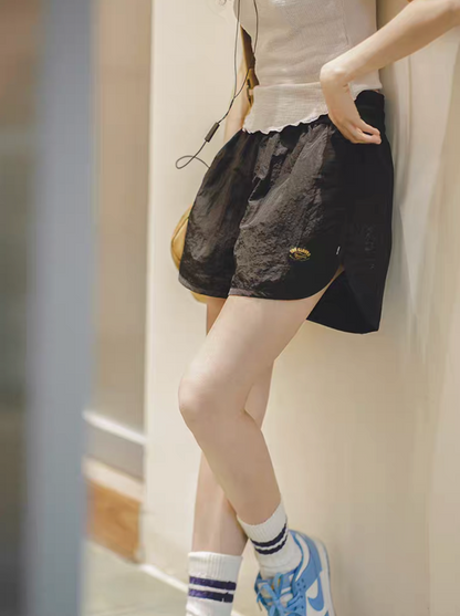Effortless Sport Shorts black worn with sleeveless top in casual indoor lifestyle setting