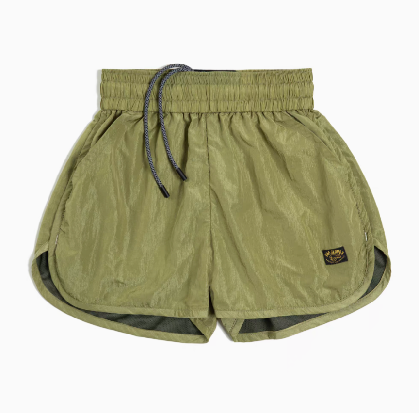 Effortless Sport Shorts matcha green front view with elastic drawstring waist and curved hem