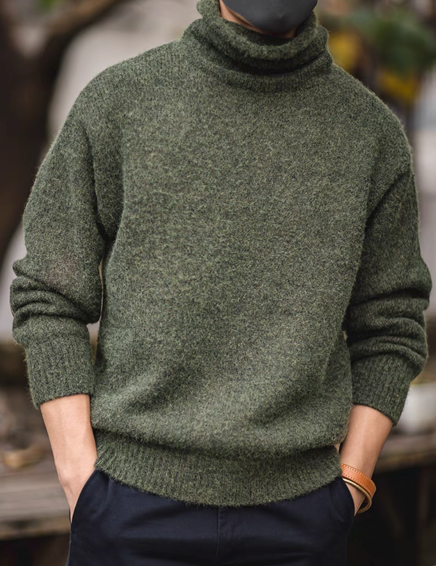 Elbow Patch Turtleneck Sweater in olive green front view showcasing coarse knit texture foldable turtleneck and relaxed everyday fit