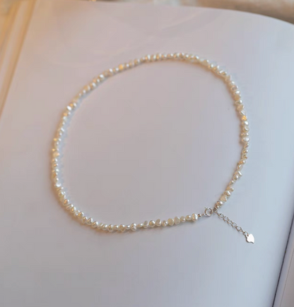 Elegant Irregular Freshwater Pearl Necklace with natural baroque mother of pearl beads full length flat lay