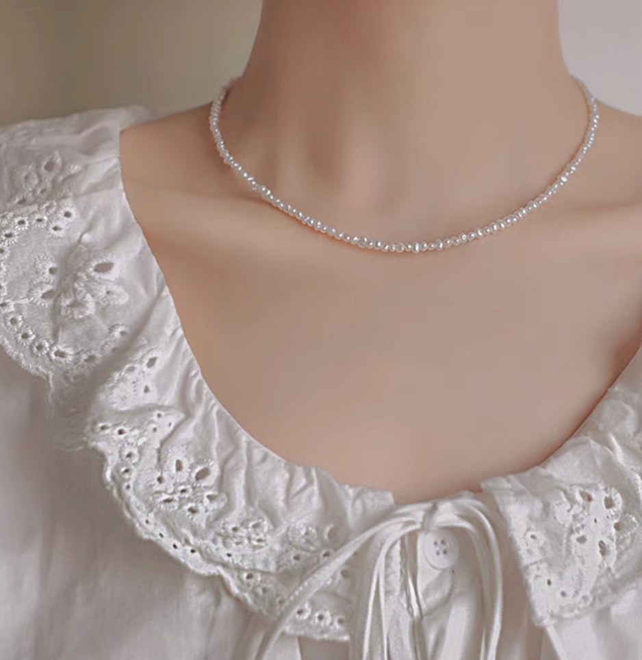 Front view of model wearing Elegant Irregular Freshwater Pearl Necklace with natural baroque mother of pearl beads