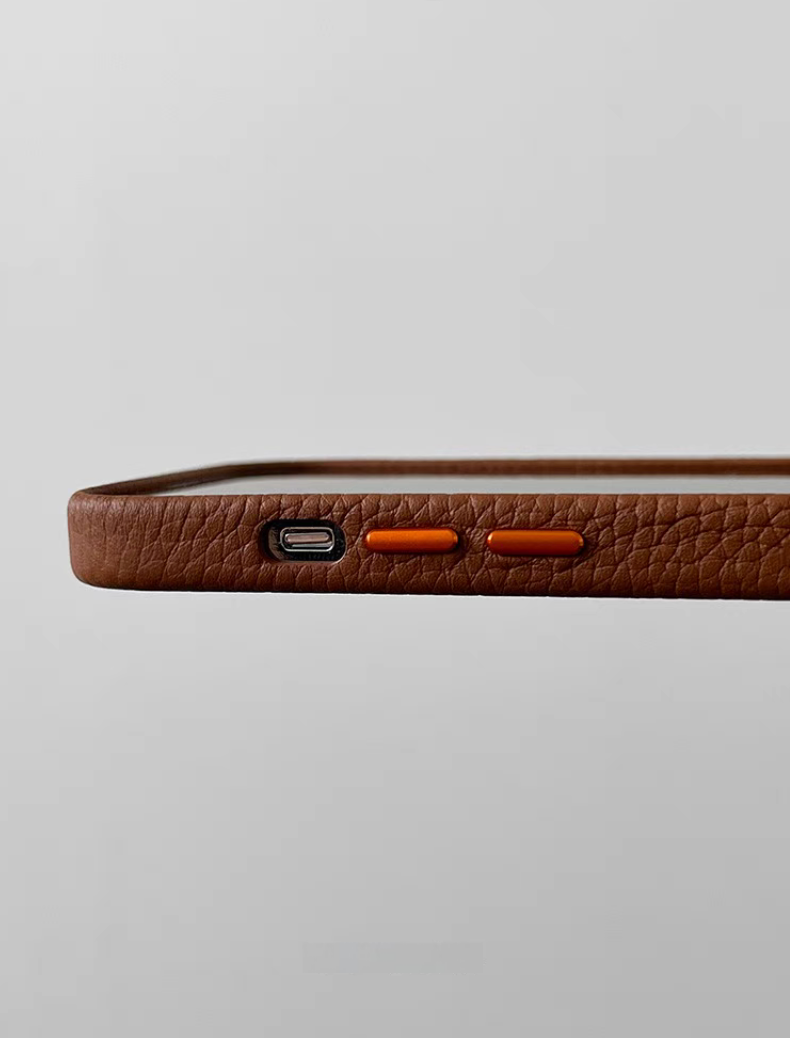 Brown leather MagSafe phone case side view with precision cut buttons and textured grip surface