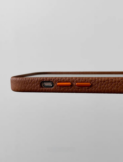 Brown leather MagSafe phone case side view with precision cut buttons and textured grip surface