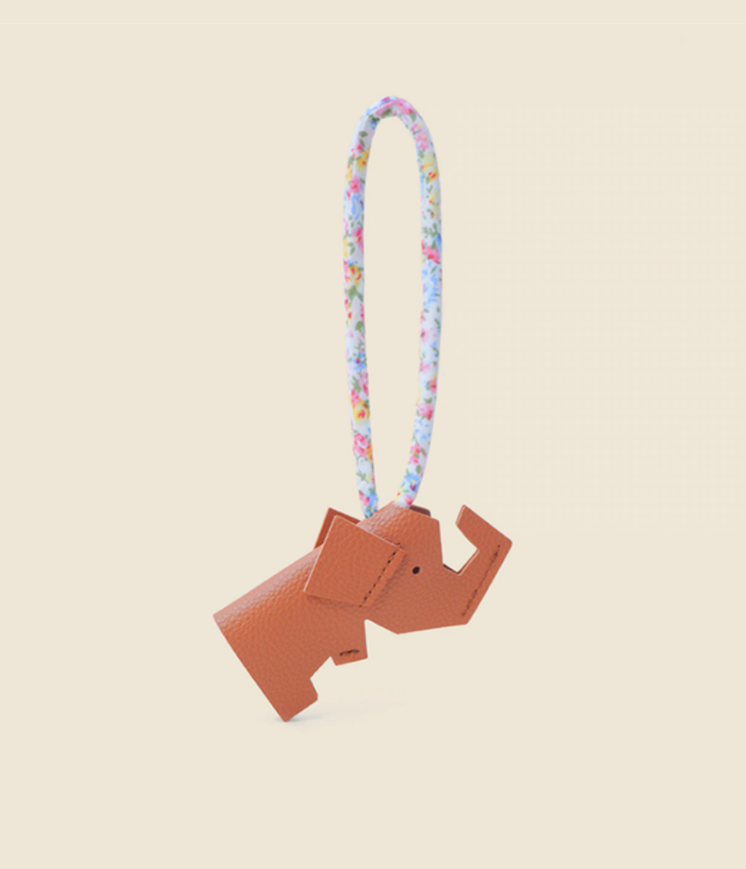 Coffee brown elephant keychain charm back angled view showing shape and strap