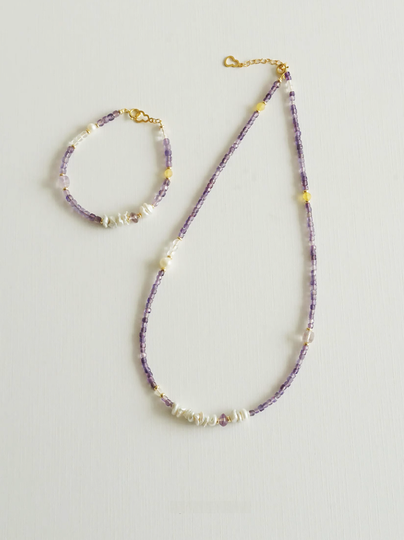 Elysian Amethyst Pearl Choker displayed with matching bracelet set highlighting amethyst beads and baroque pearl details