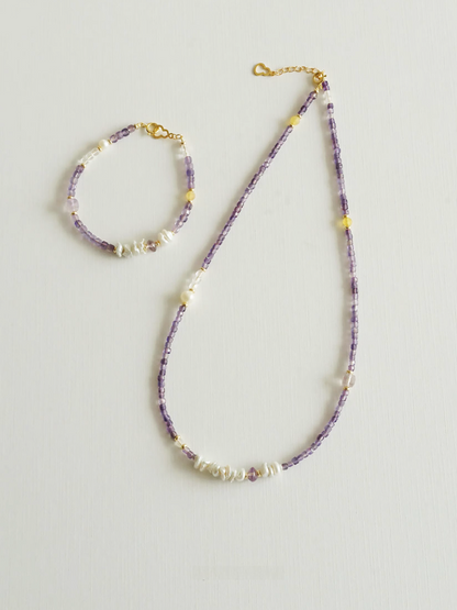 Elysian Amethyst Pearl Choker displayed with matching bracelet set highlighting amethyst beads and baroque pearl details