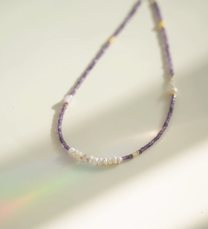 Elysian Amethyst Pearl Choker close-up showing baroque pearl cluster with purple amethyst beads and gold-plated accents