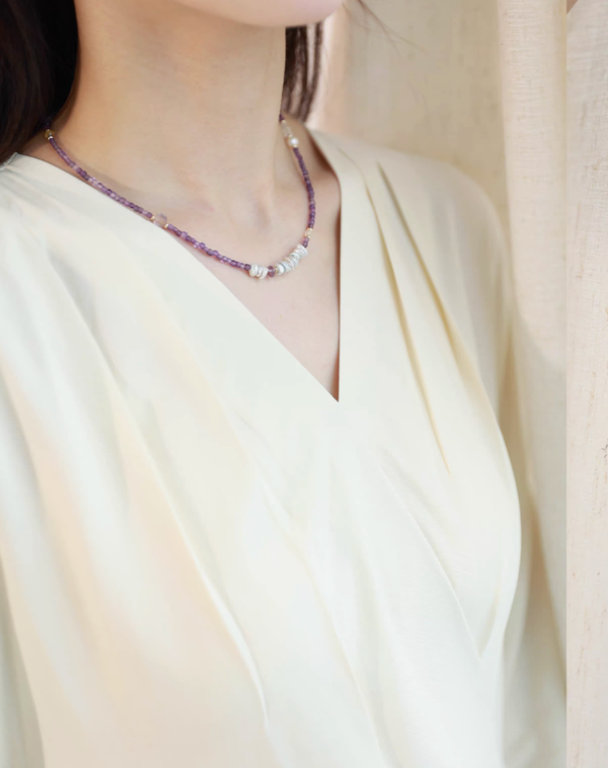Elysian Amethyst Pearl Choker worn on neck showcasing delicate amethyst beads and central baroque pearl cluster