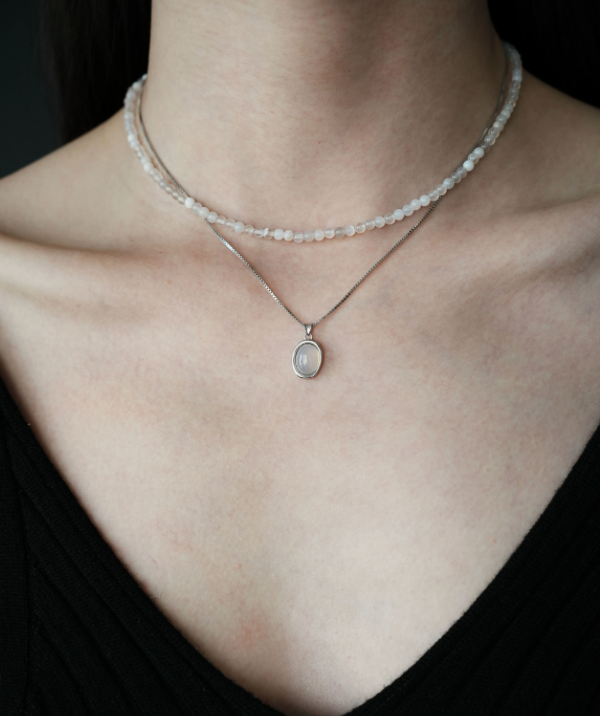 Model wearing Ethereal Elegance Gray Agate Necklace and Choker Set featuring layered gray agate choker and silver pendant necklace