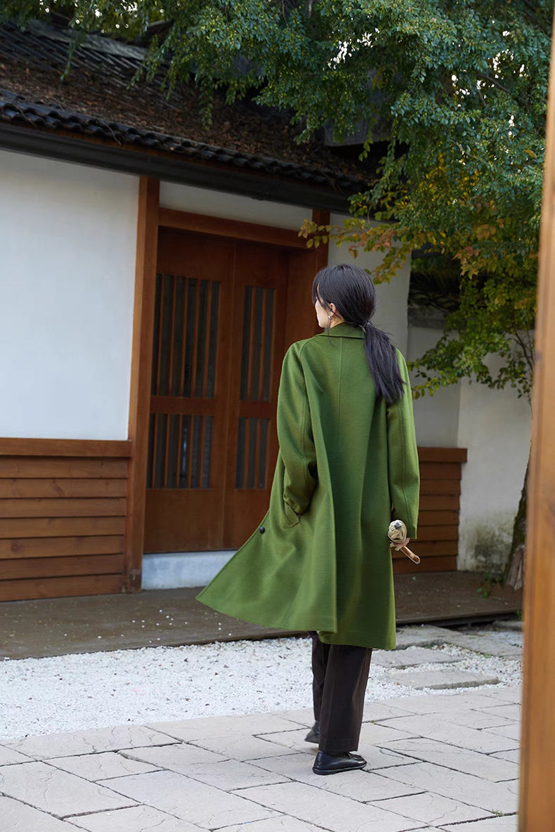 Army green wool overcoat back walking view showing fluid drape and clean back silhouette