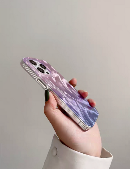 Purple gradient feather design phone case side angle view showing textured finish and clear edge frame