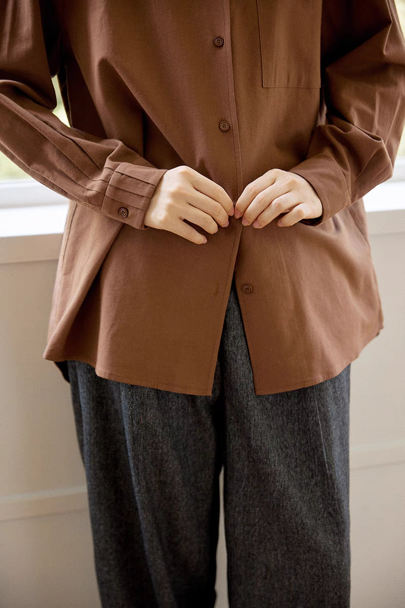 Close-up of brown Flex-Weave cotton shirt front and cuff detail, highlighting button closure, sleeve cuff design, and refined fabric finish